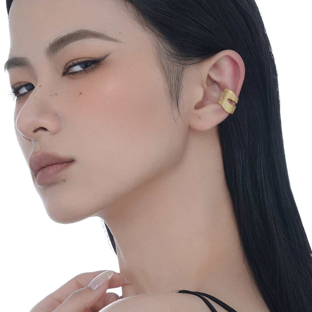 Asymmetrical wide textured huggie open earring